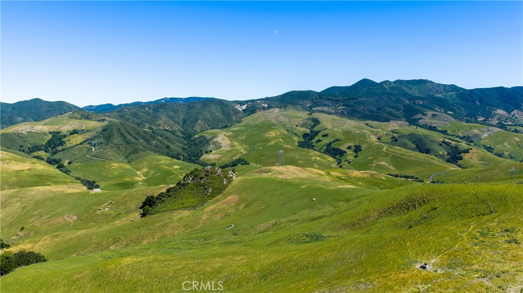 2440 Little Morro Creek Road Morro Bay, CA 93442 - Photo 34 of 39 a view of a lush green hillside and a houses