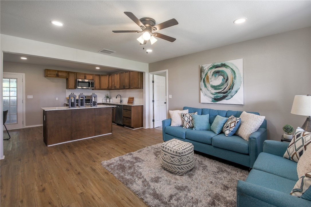 400 Harris Street Elgin, TX 78621 - Photo 1 of 1 a living room with furniture and kitchen