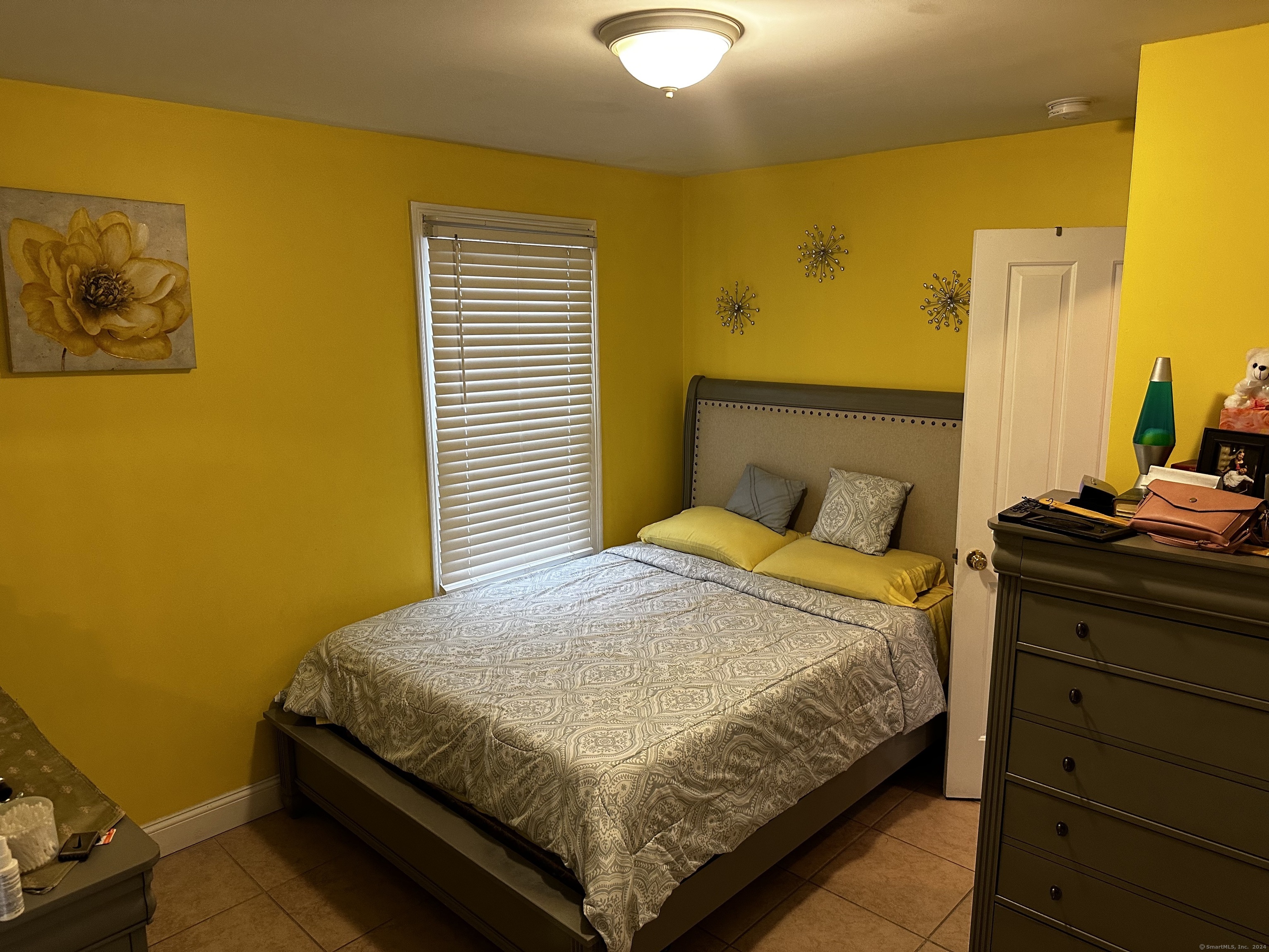 504 Dixwell Avenue New Haven, CT 06511 - Photo 12 of 26 a bedroom with a bed and wooden floor