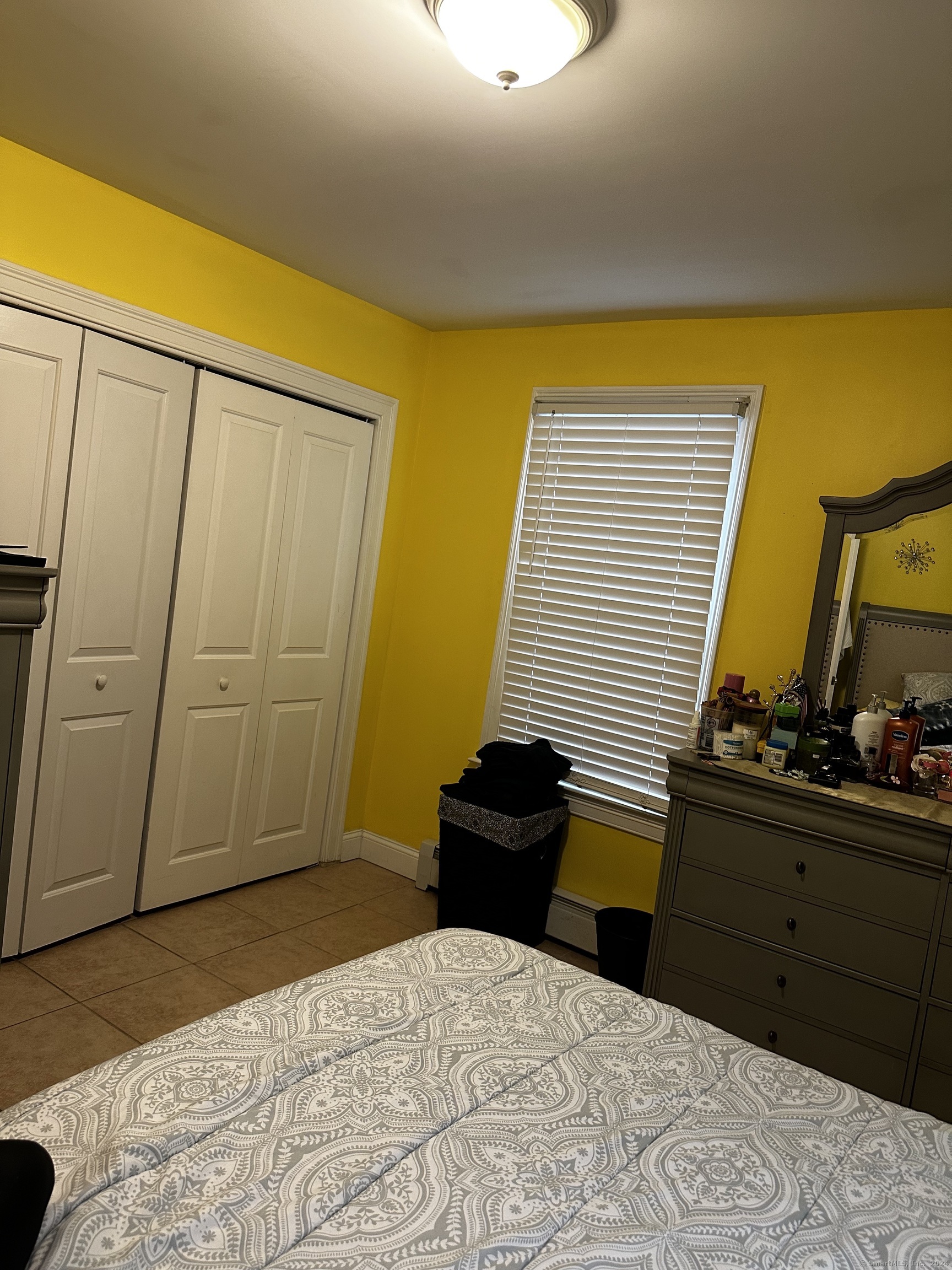 504 Dixwell Avenue New Haven, CT 06511 - Photo 13 of 26 a bedroom with a bed and a dresser