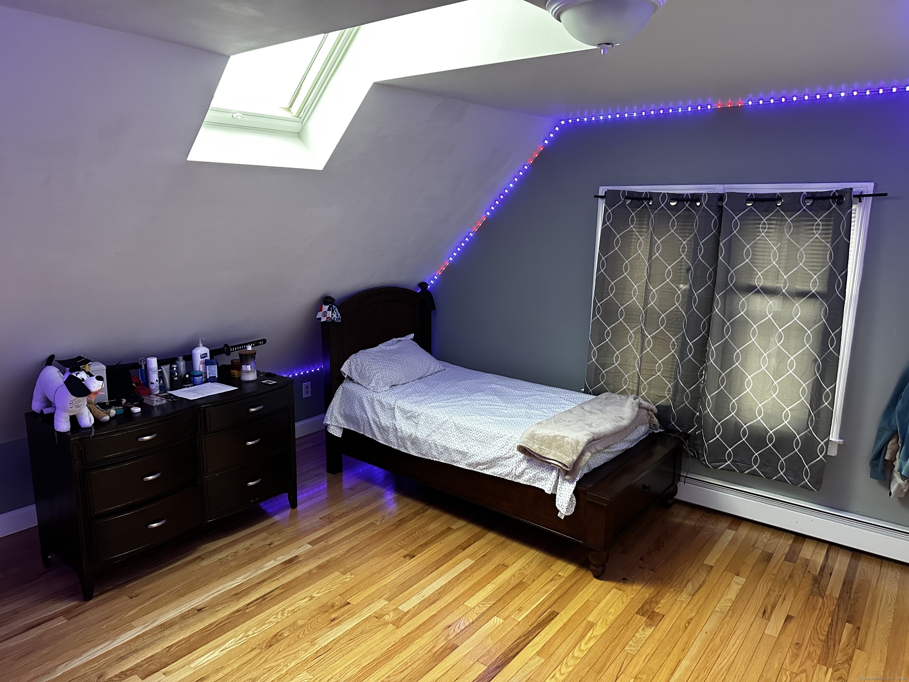 504 Dixwell Avenue New Haven, CT 06511 - Photo 17 of 26 a bedroom with a bed and a window