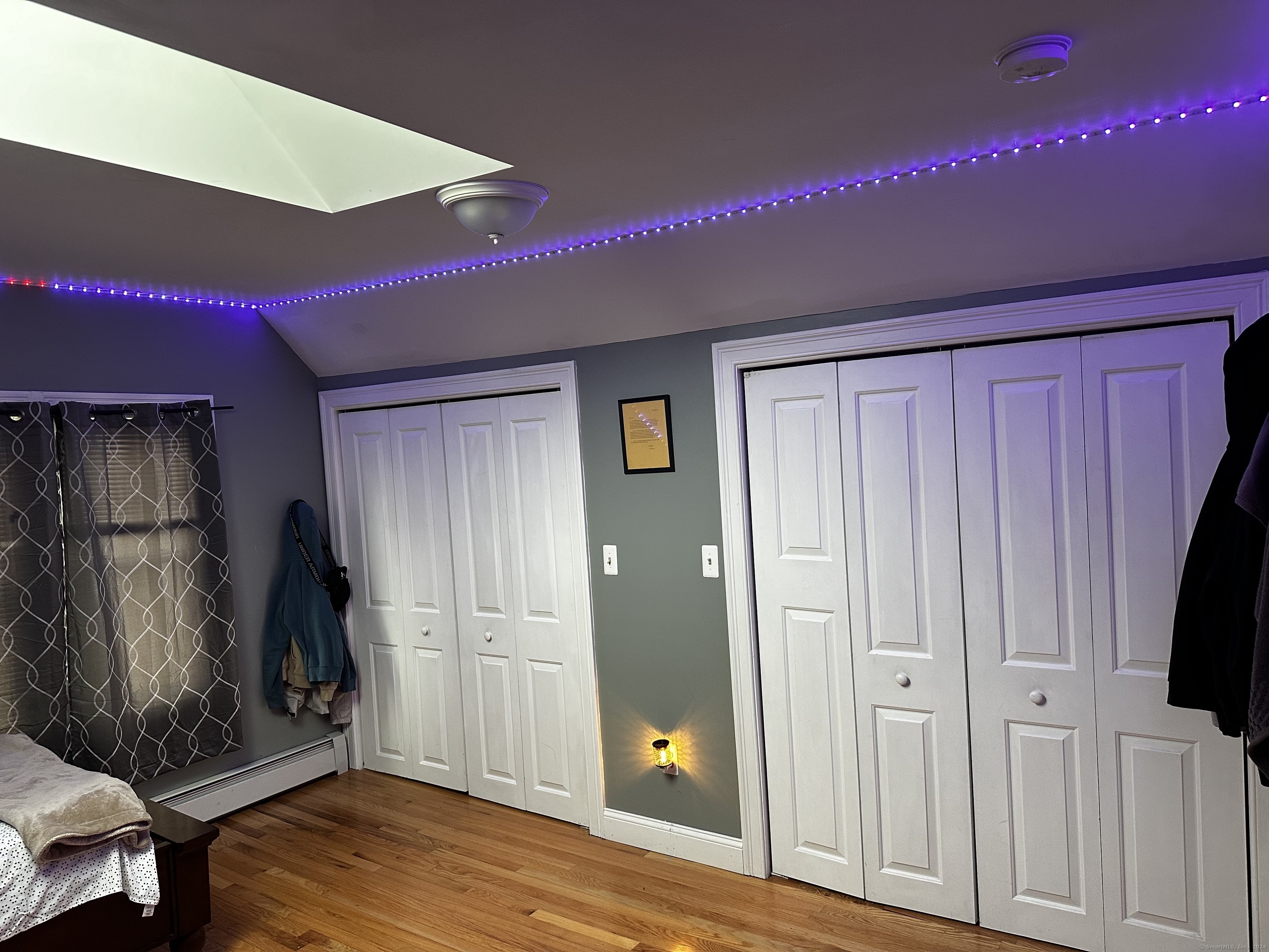 504 Dixwell Avenue New Haven, CT 06511 - Photo 18 of 26 a view of a hallway with wooden floor and closet area