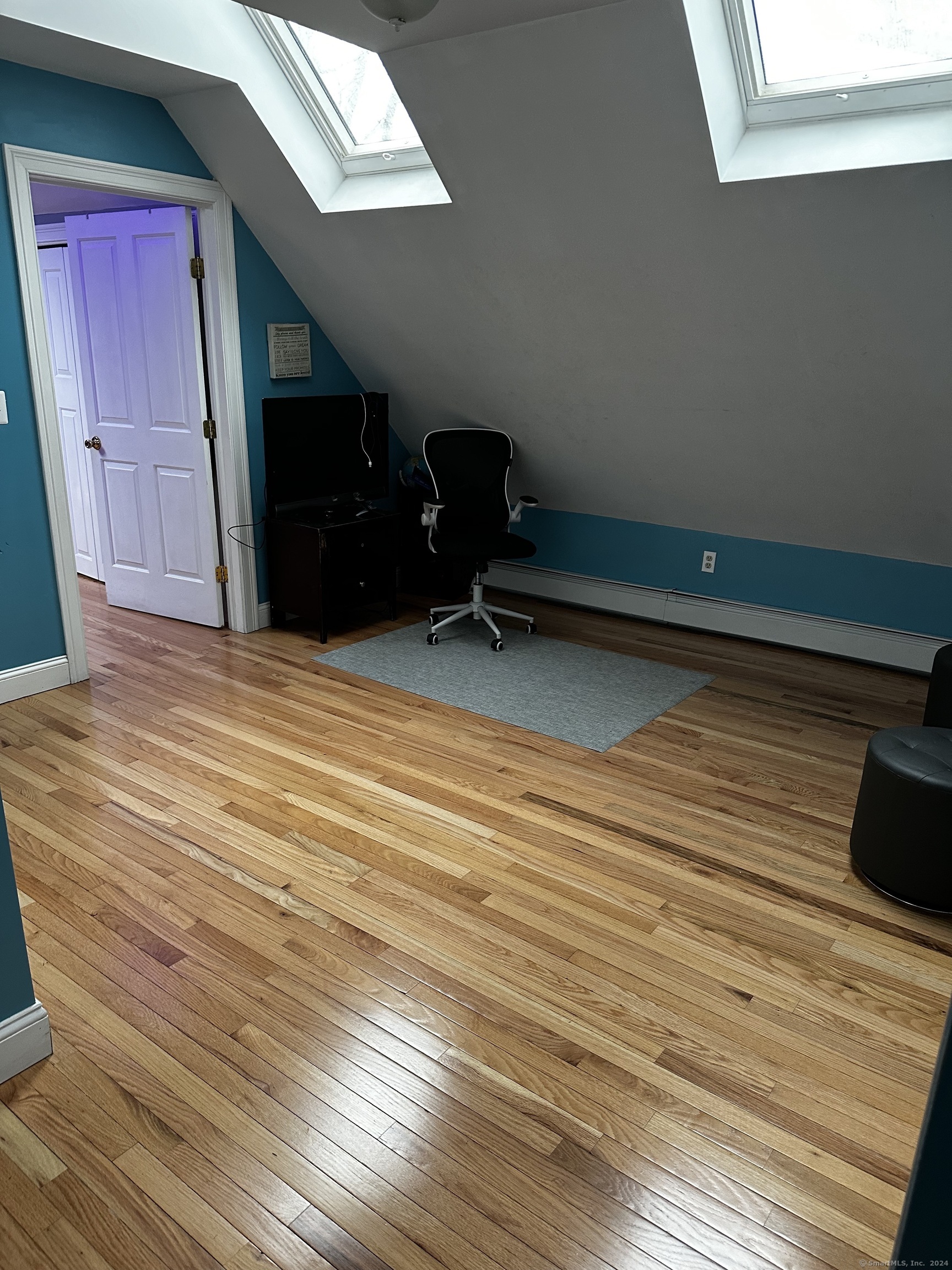 504 Dixwell Avenue New Haven, CT 06511 - Photo 20 of 26 a view of an empty room with wooden floor and a window