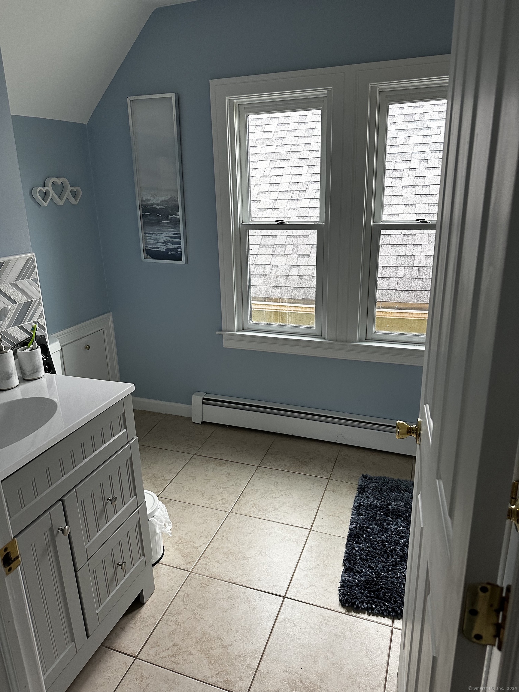 504 Dixwell Avenue New Haven, CT 06511 - Photo 24 of 26 a bathroom with a sink toilet and window