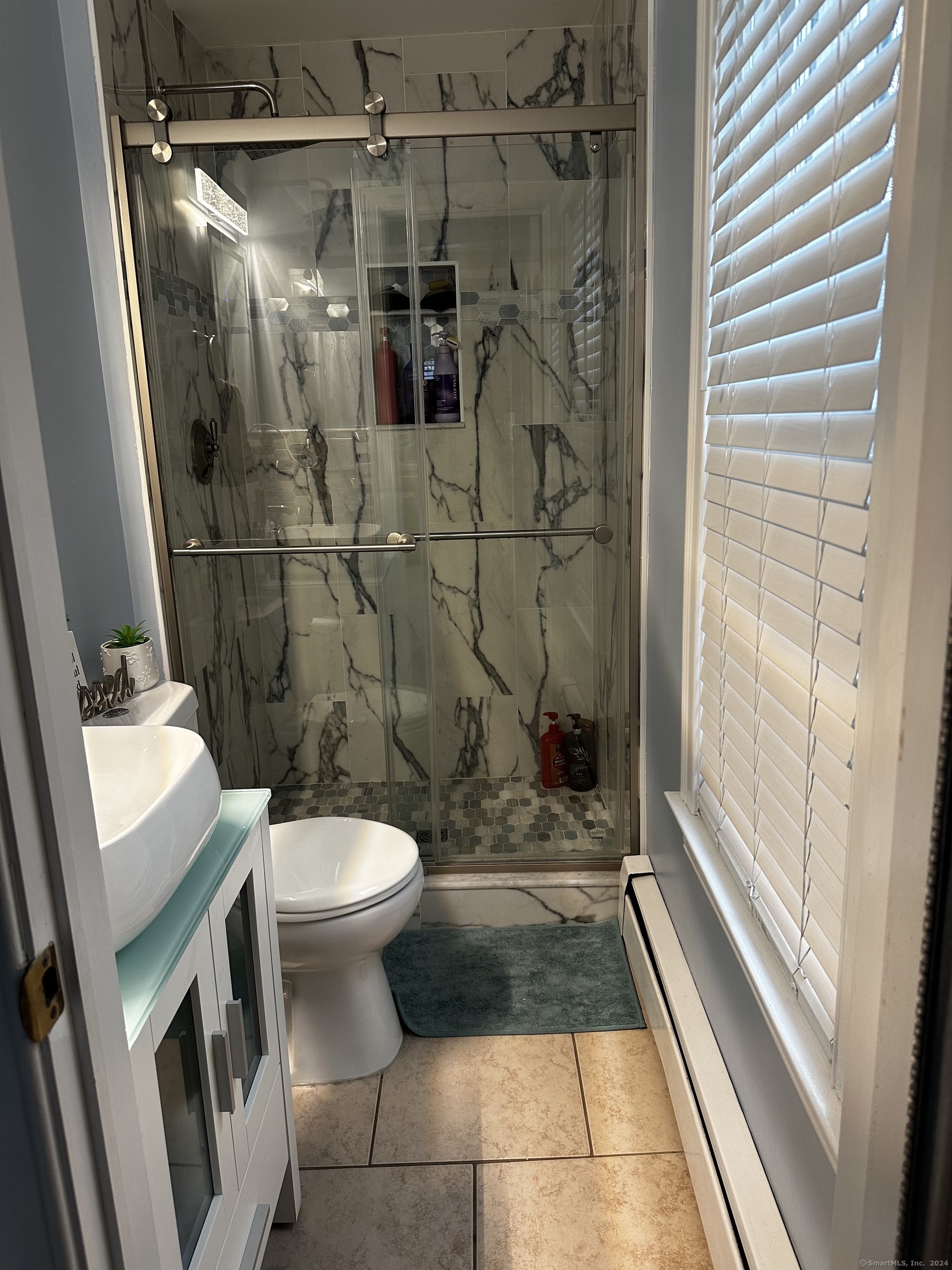 504 Dixwell Avenue New Haven, CT 06511 - Photo 6 of 26 a bathroom with a sink and toilet