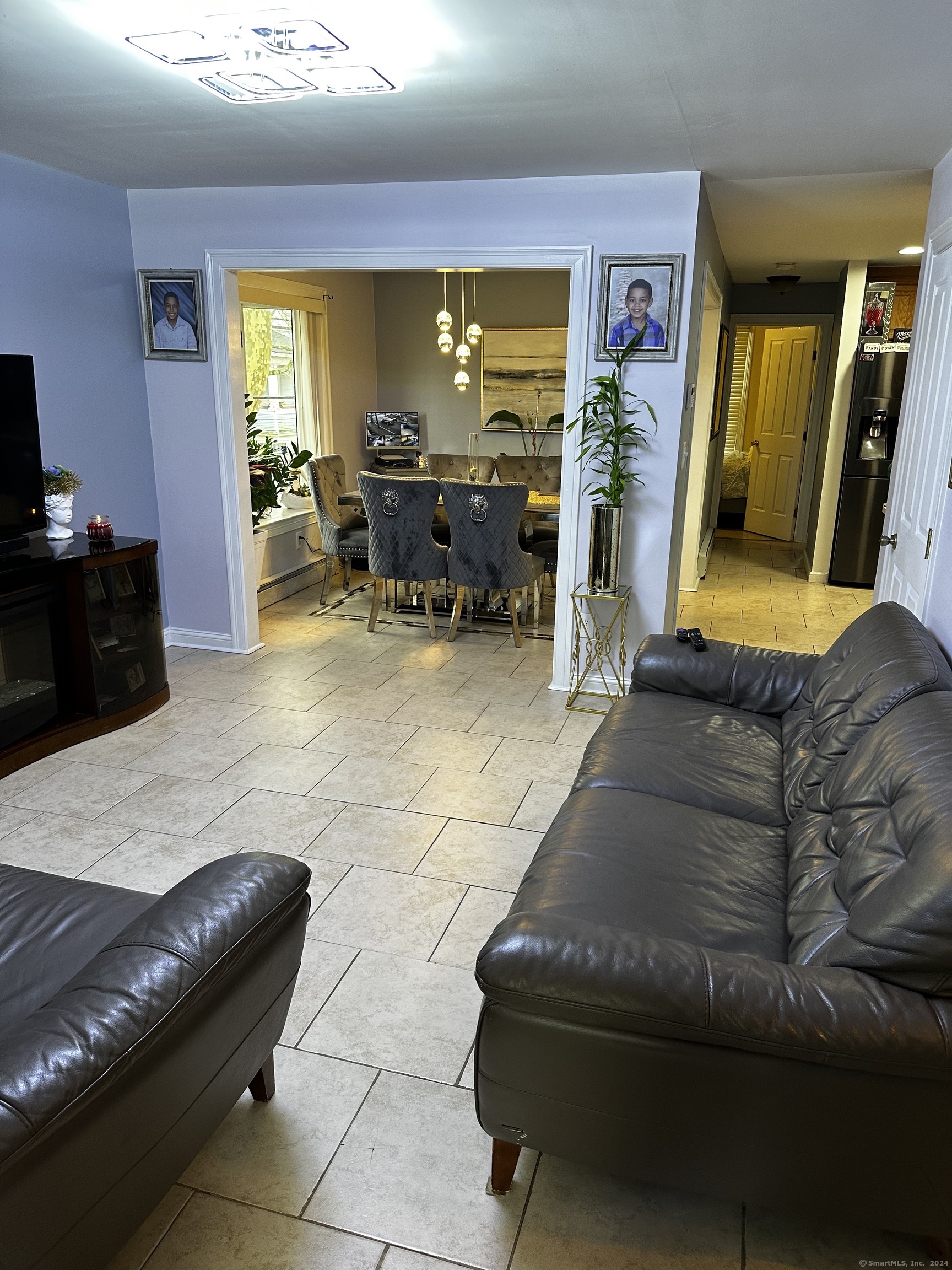 504 Dixwell Avenue New Haven, CT 06511 - Photo 7 of 26 a living room with furniture and a large window