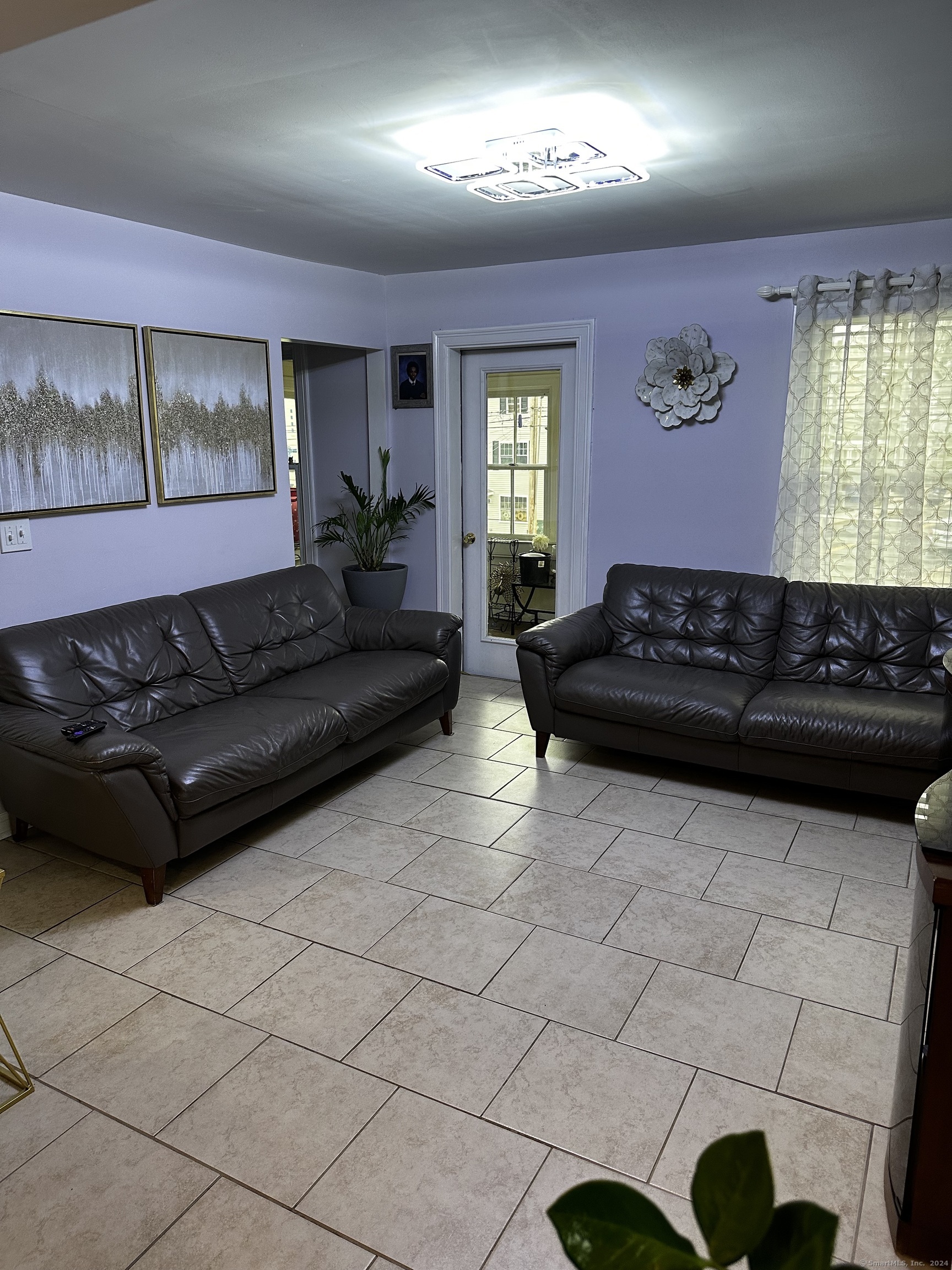 504 Dixwell Avenue New Haven, CT 06511 - Photo 8 of 26 a living room with furniture and a window