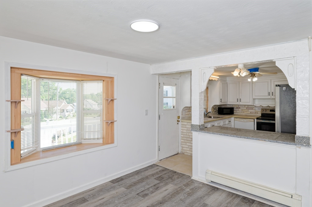 1 Rockland Rd Court Auburn, MA 01501 - Photo 10 of 38 a large kitchen with a lot of counter space and a wooden floor