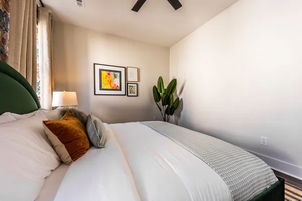 a bedroom with a bed and a window