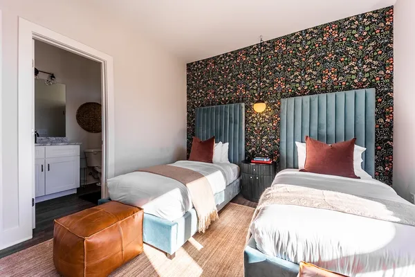 a bedroom with bed and window
