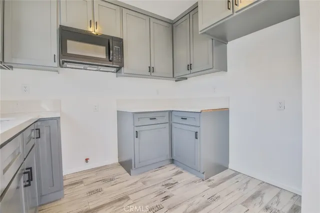 a view of cabinets and wooden floor