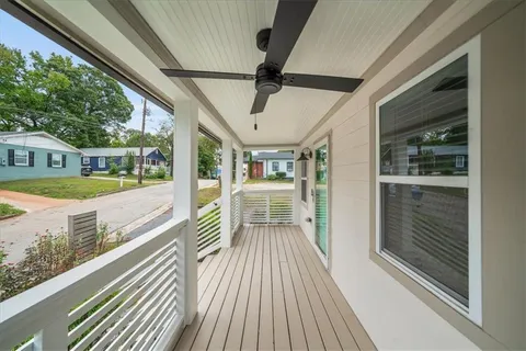 a view of a balcony with wooden floor