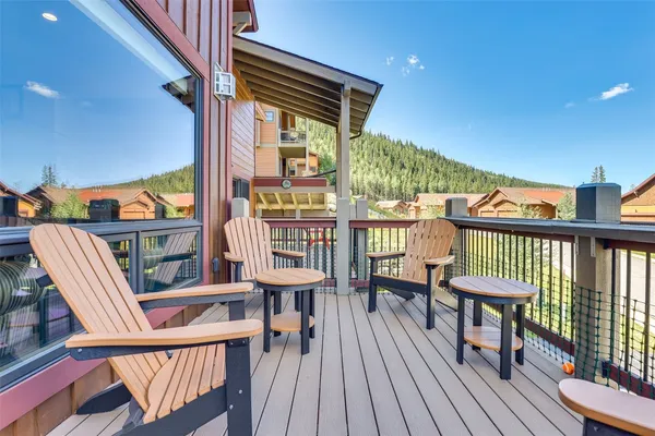 a view of a balcony with chairs