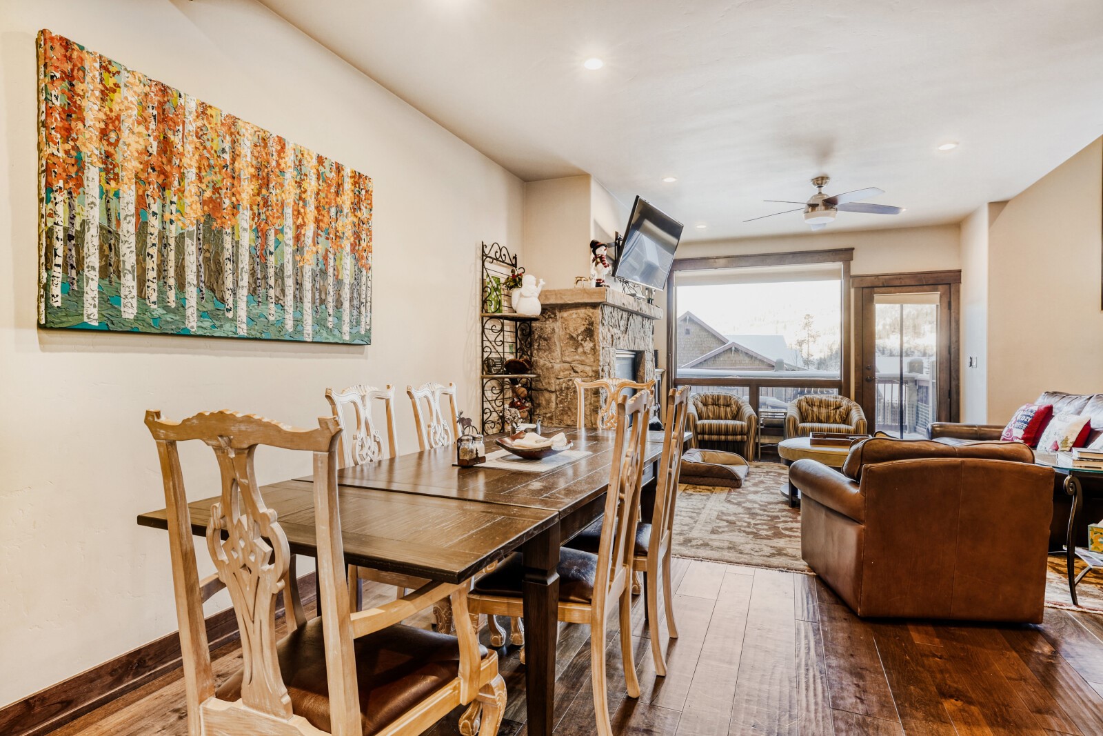 852 Independence Road, Unit B Keystone, CO 80435 - Photo 15 of 40 a view of a dining room with furniture window and wooden floor