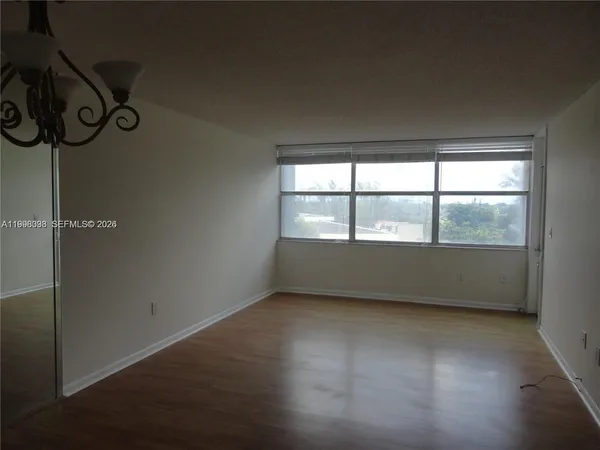 a view of an empty room with a window