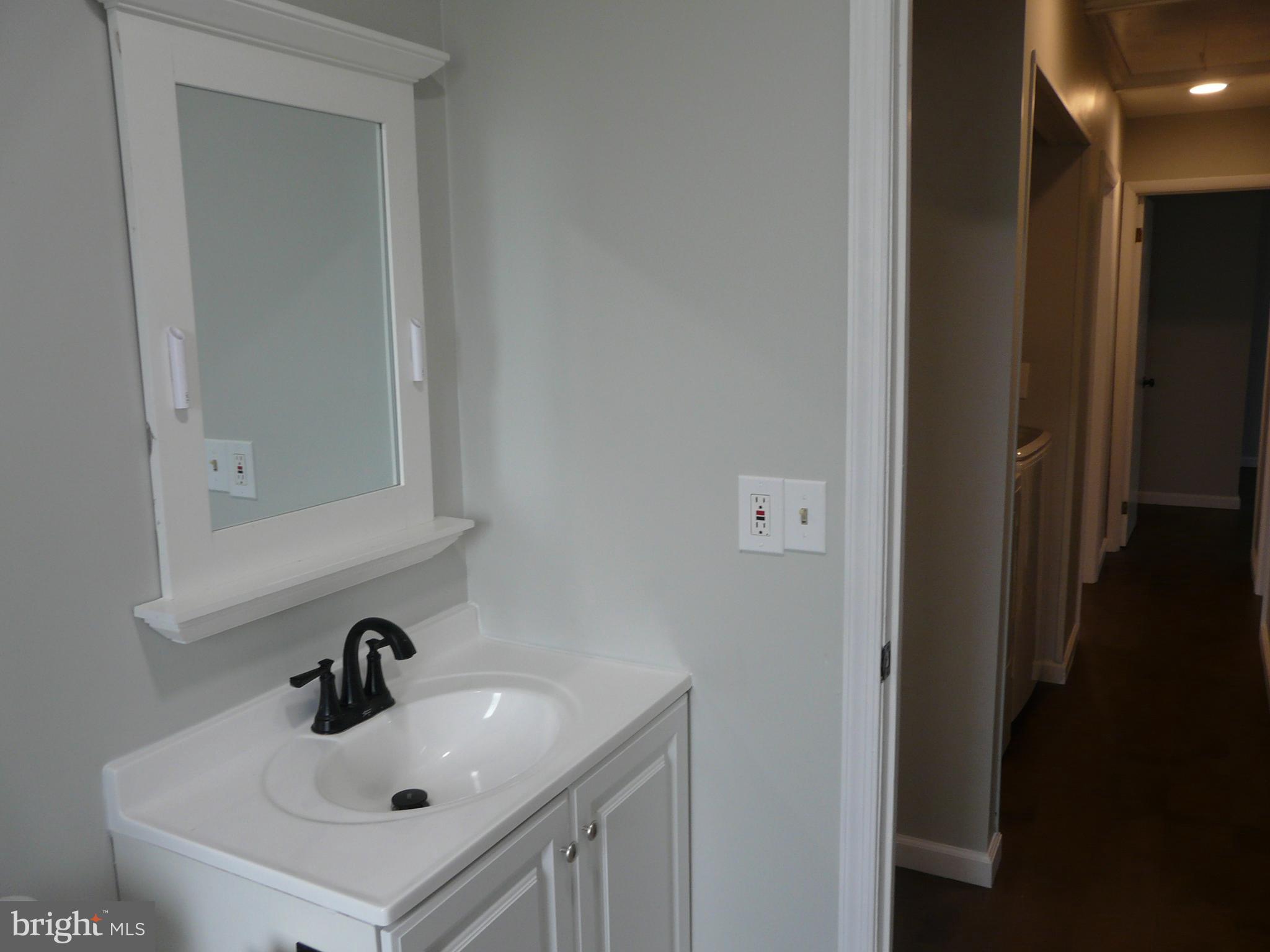 1009 Fuselage Avenue Middle River, MD 21220 - Photo 10 of 28 a bathroom with a sink and a mirror