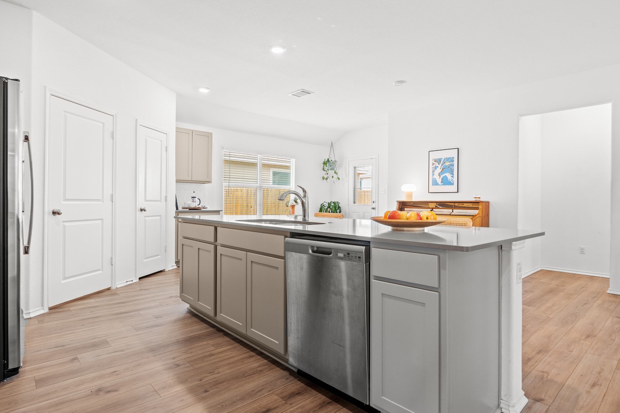 124 Perfect World Loop Jarrell, TX 76537 - Photo 11 of 32 a kitchen with cabinets and window