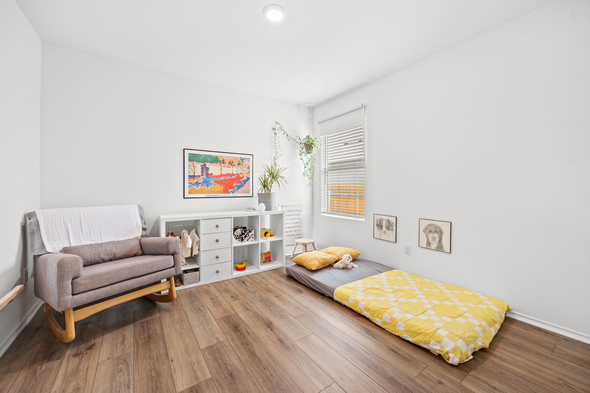 124 Perfect World Loop Jarrell, TX 76537 - Photo 16 of 32 a bedroom with furniture and a wooden floor