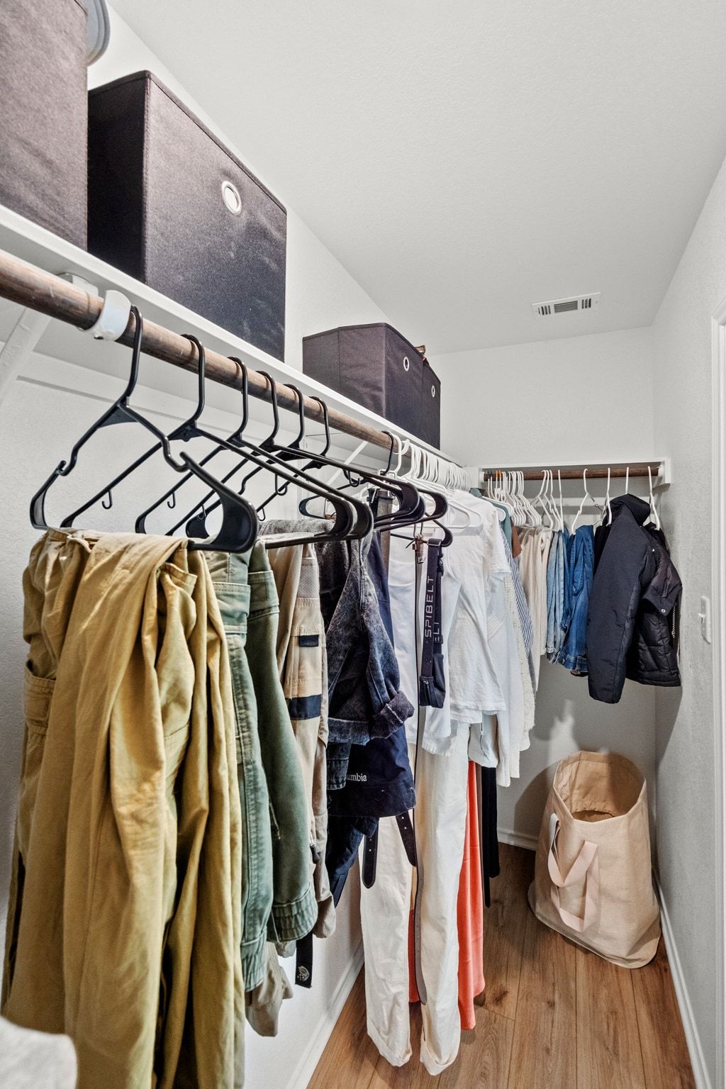 124 Perfect World Loop Jarrell, TX 76537 - Photo 20 of 32 a view of walk in closet with clothes and shoes