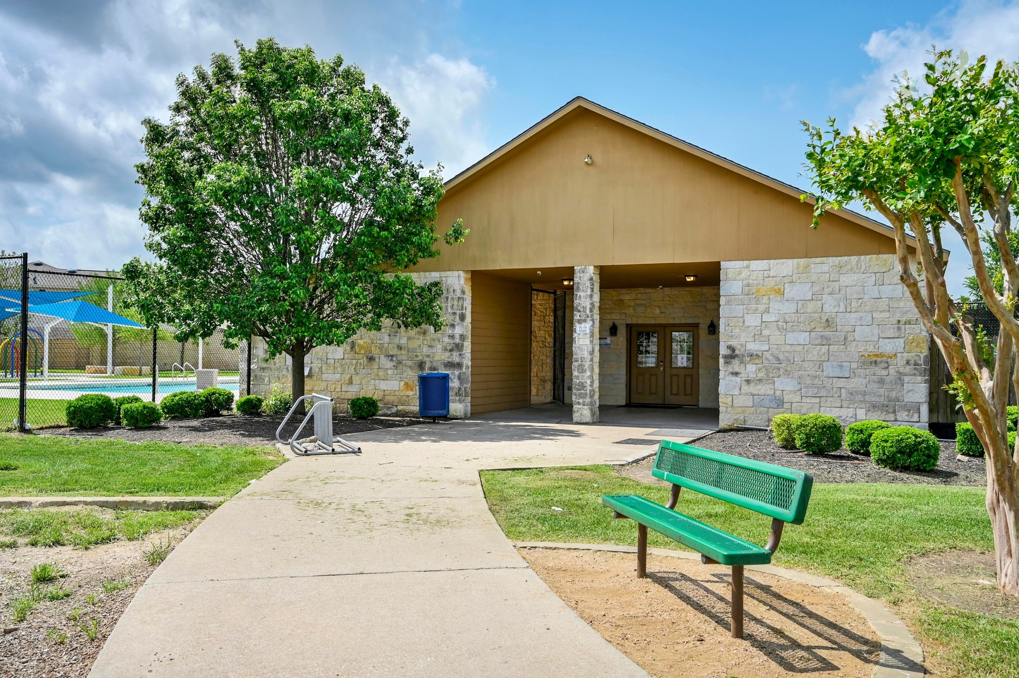 124 Perfect World Loop Jarrell, TX 76537 - Photo 27 of 32 a view of a house with a yard plants and a tree