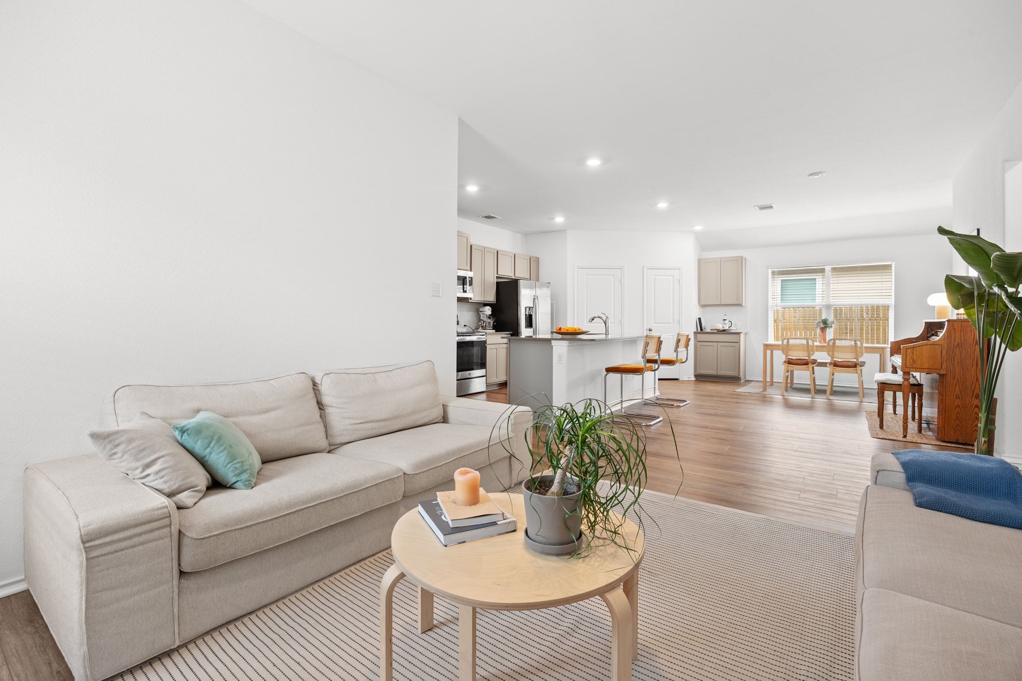 124 Perfect World Loop Jarrell, TX 76537 - Photo 9 of 32 a living room with furniture kitchen view and a dining table