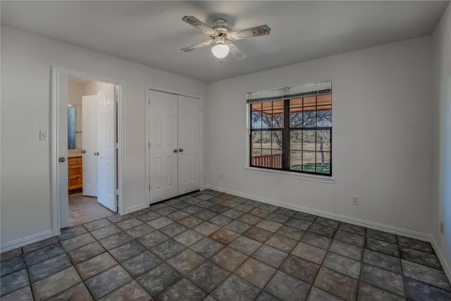 a view of an empty room and window