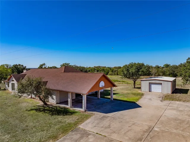 a aerial view of a house with a yard