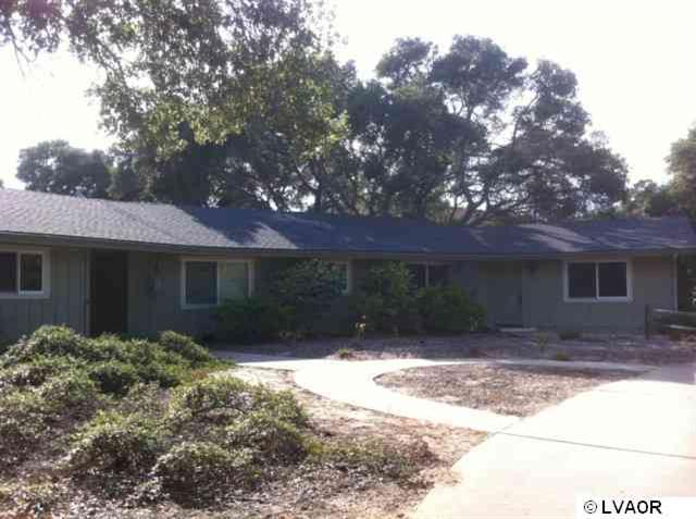 1220 Onstott Road Lompoc, CA 93436 - Photo 1 of 5 a front view of a house with a yard and garage