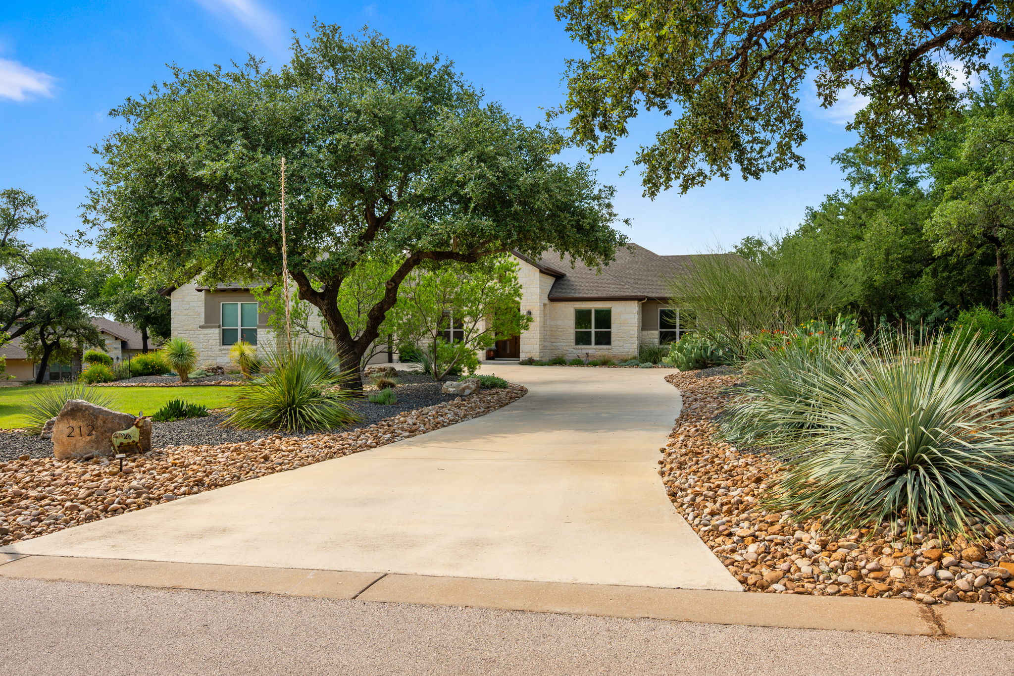 212 Marbella Way Georgetown, TX 78633 - Photo 3 of 40 a front view of a house with a garden