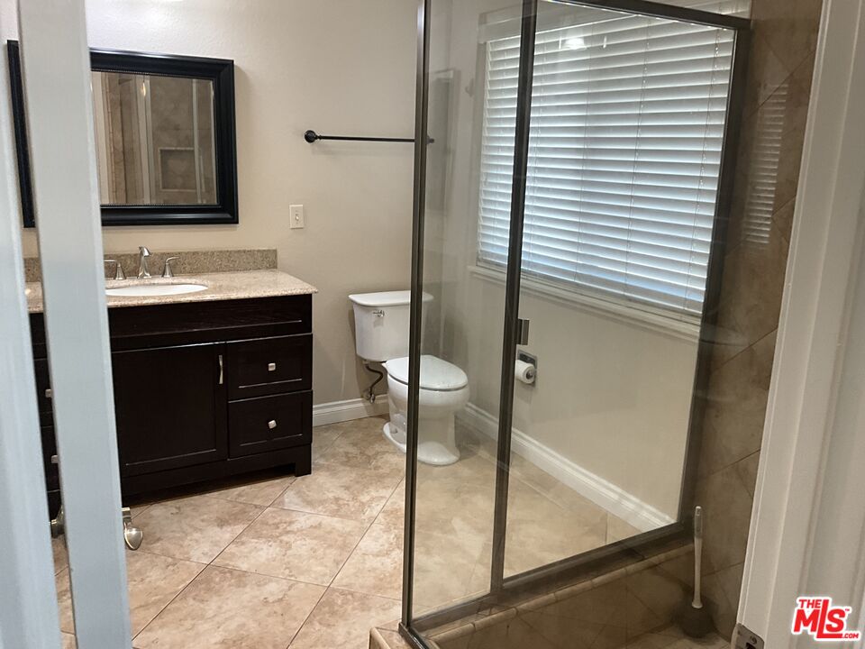 19125 Ottawa Road Apple Valley, CA 92308 - Photo 11 of 15 a bathroom with a sink and a mirror