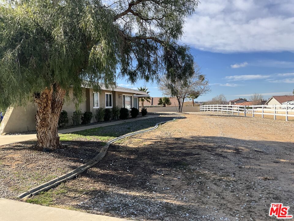 19125 Ottawa Road Apple Valley, CA 92308 - Photo 15 of 15 a view of a house with a yard and lake view