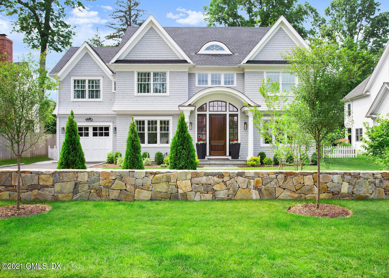 74 Summit Road Riverside, CT 06878 - Photo 1 of 48 a front view of a house with a yard
