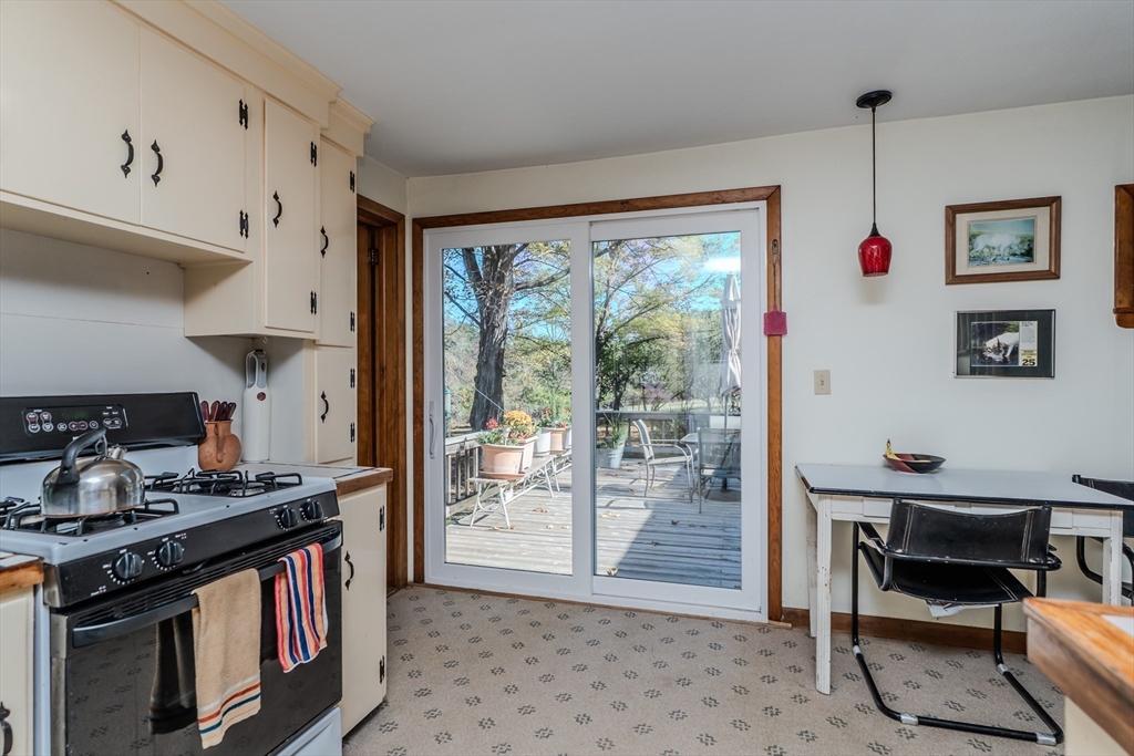 200 Long Plain Road Leverett, MA 01054 - Photo 15 of 40 a kitchen with stainless steel appliances granite countertop a stove and a refrigerator
