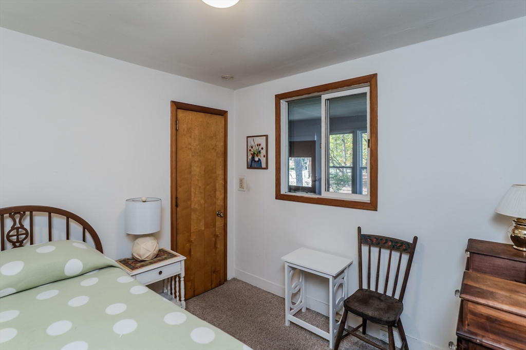 200 Long Plain Road Leverett, MA 01054 - Photo 17 of 40 a bedroom with a bed and wooden floor