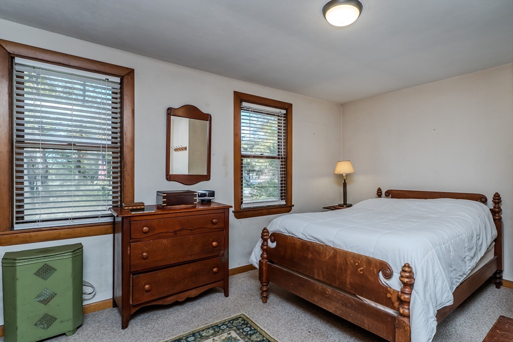 200 Long Plain Road Leverett, MA 01054 - Photo 20 of 40 a bedroom with a bed and window with mirror