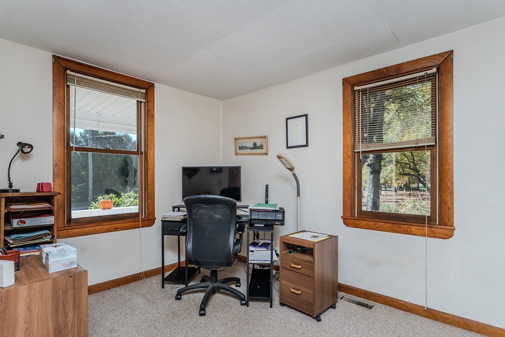200 Long Plain Road Leverett, MA 01054 - Photo 22 of 40 a view of a workspace with furniture and a window
