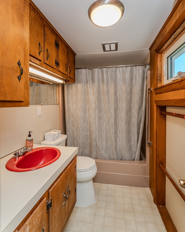 200 Long Plain Road Leverett, MA 01054 - Photo 23 of 40 a bathroom with a sink a toilet and shower curtain