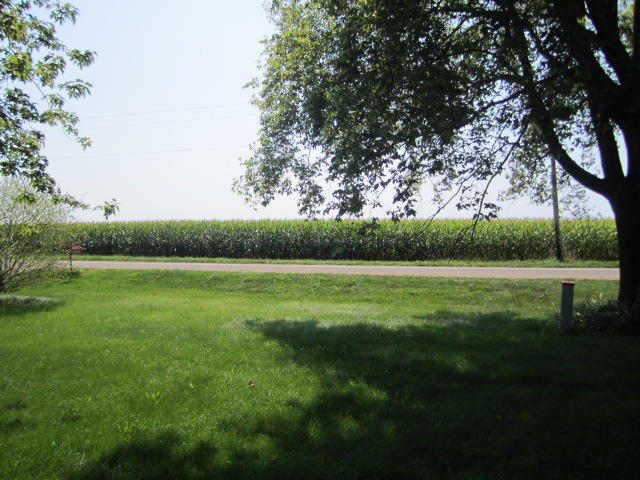 1443 North 32nd Road Ottawa, IL 61350 - Photo 11 of 11 a view of a green field with wooden fence