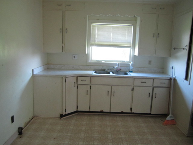 1443 North 32nd Road Ottawa, IL 61350 - Photo 4 of 11 a room with a sink cabinets and a window