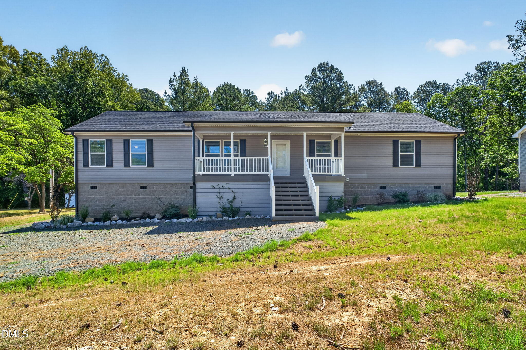 a house with trees in the background
