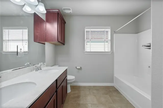 a bathroom with a sink a vanity and a mirror