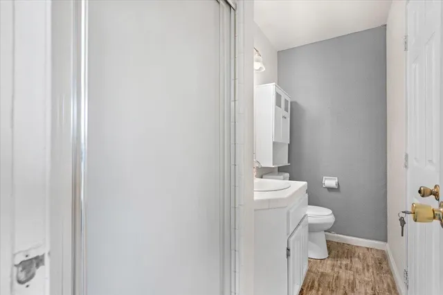 a bathroom with a toilet and a shower