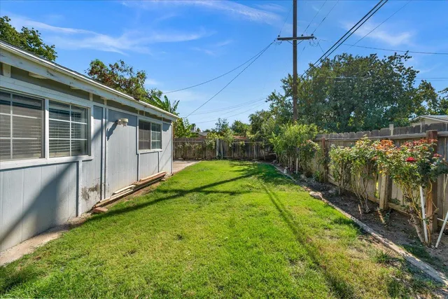 a view of a backyard with potted plants
