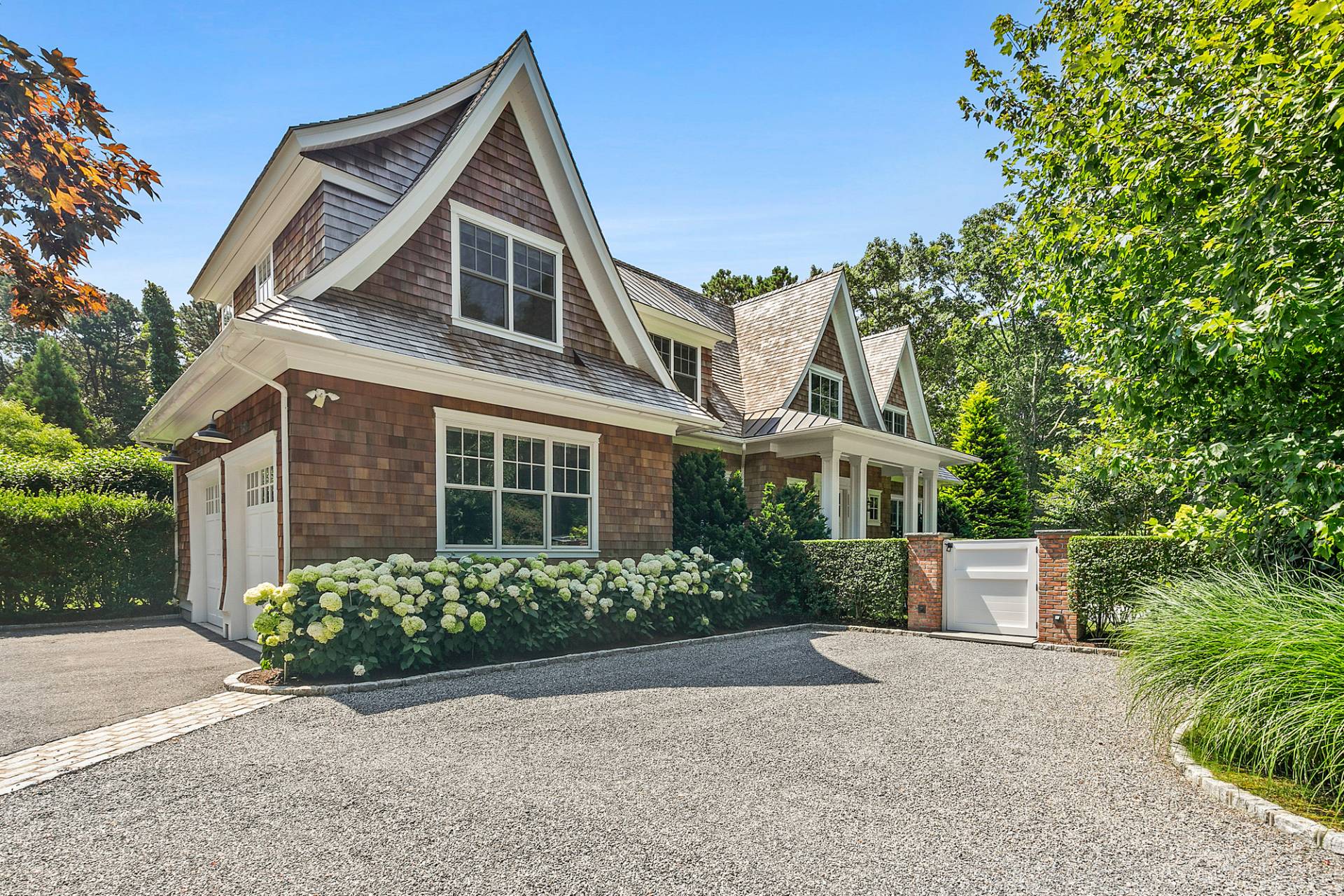 40 Roxbury Lane Wainscott, NY 11975 - Photo 2 of 29 front view of a house with a yard