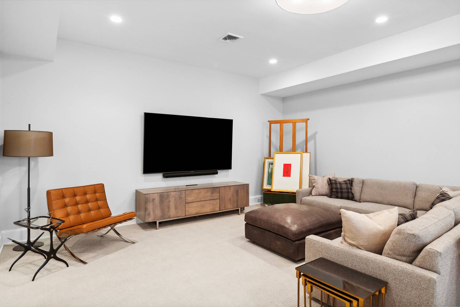 40 Roxbury Lane Wainscott, NY 11975 - Photo 21 of 29 a living room with furniture and a flat screen tv