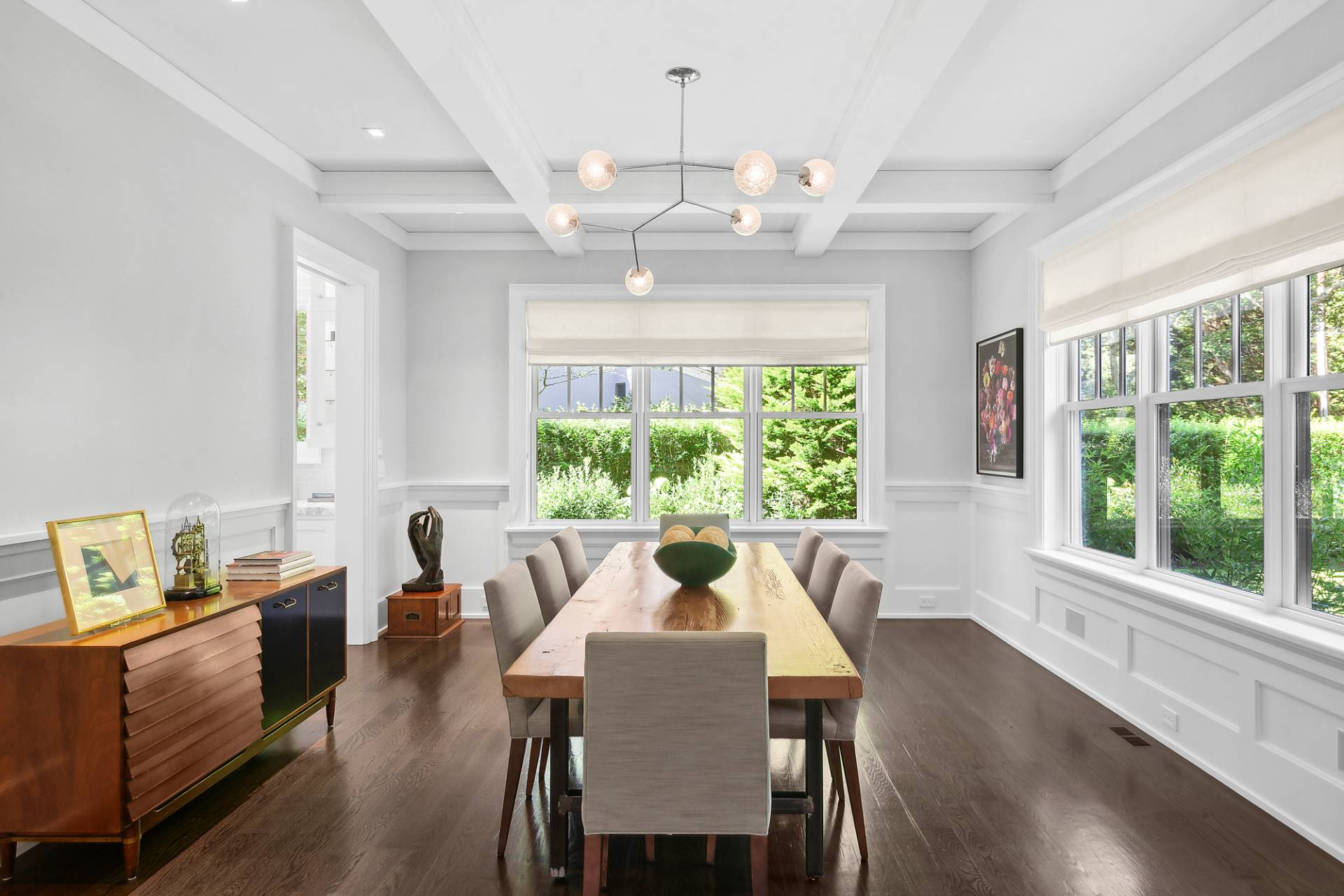 40 Roxbury Lane Wainscott, NY 11975 - Photo 7 of 29 a view of a dining room with furniture a chandelier and wooden floor