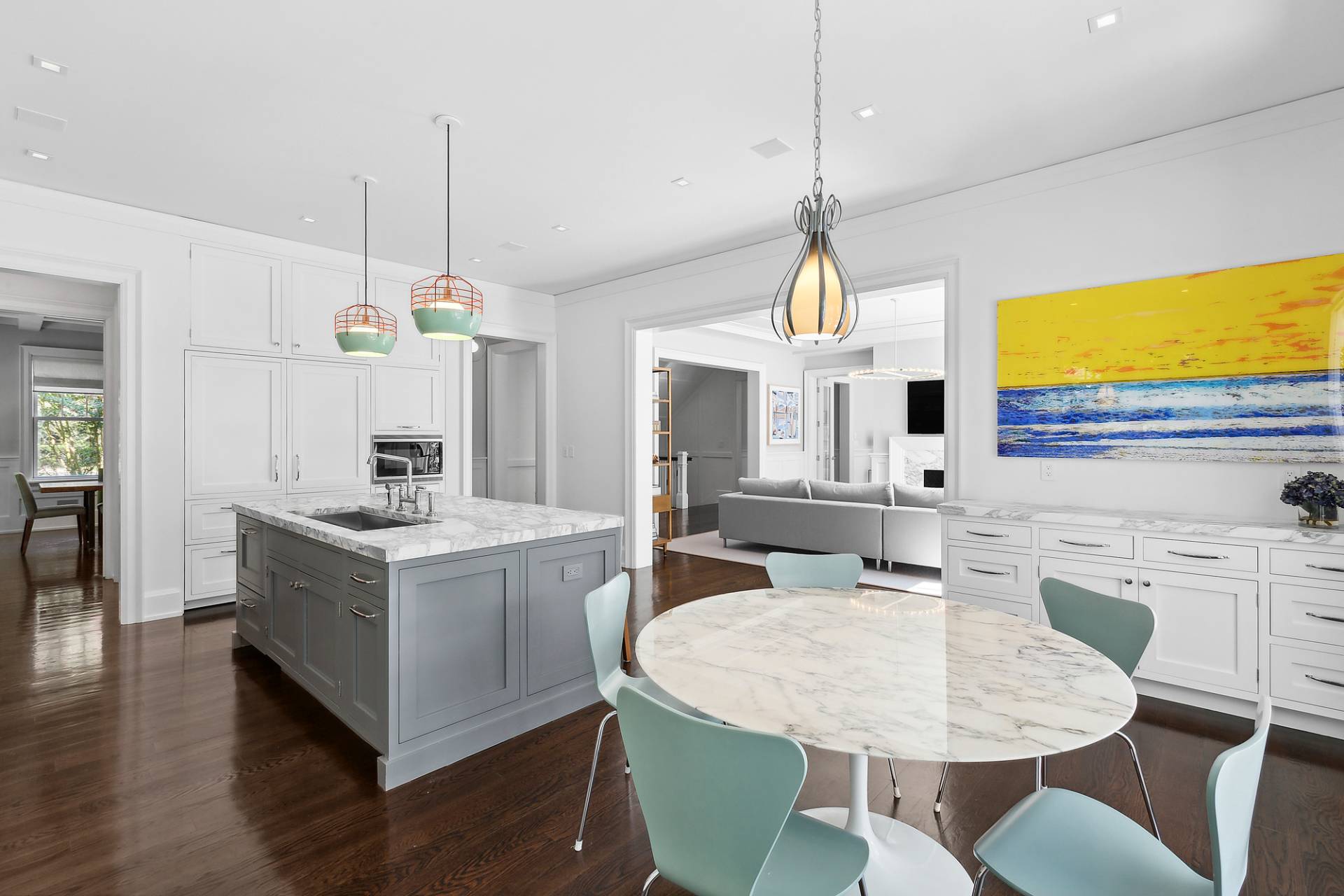 40 Roxbury Lane Wainscott, NY 11975 - Photo 9 of 29 a kitchen that has a kitchen island a stove a table and chairs in it