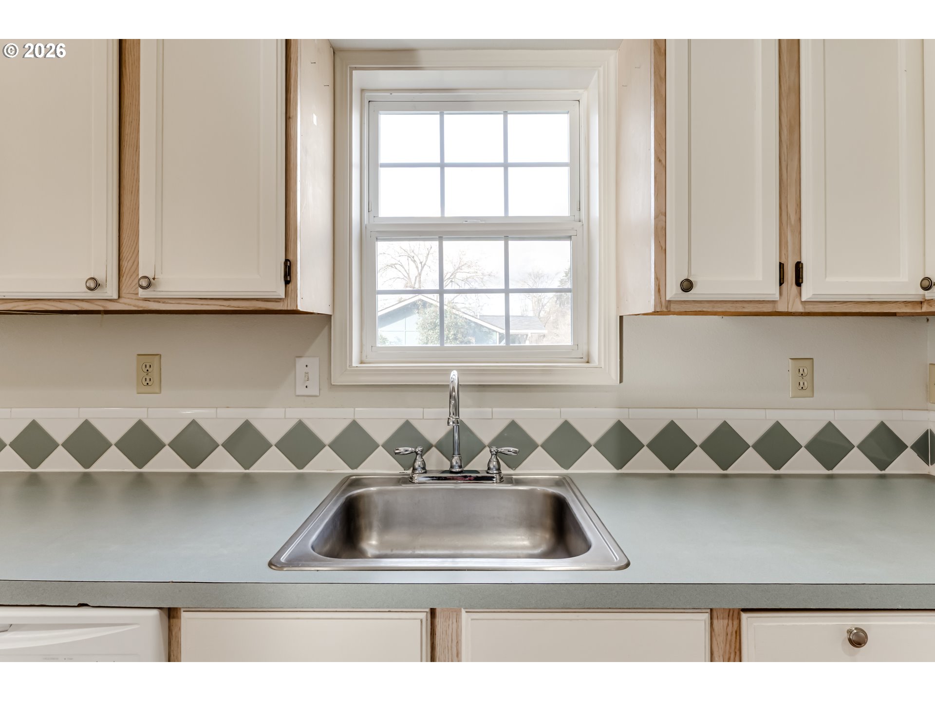 951 West 27th Avenue Eugene, OR 97405 - Photo 12 of 34 a kitchen with a sink and cabinets