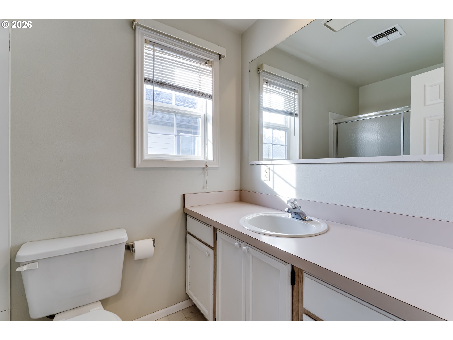 951 West 27th Avenue Eugene, OR 97405 - Photo 20 of 34 a bathroom with a sink a toilet and window