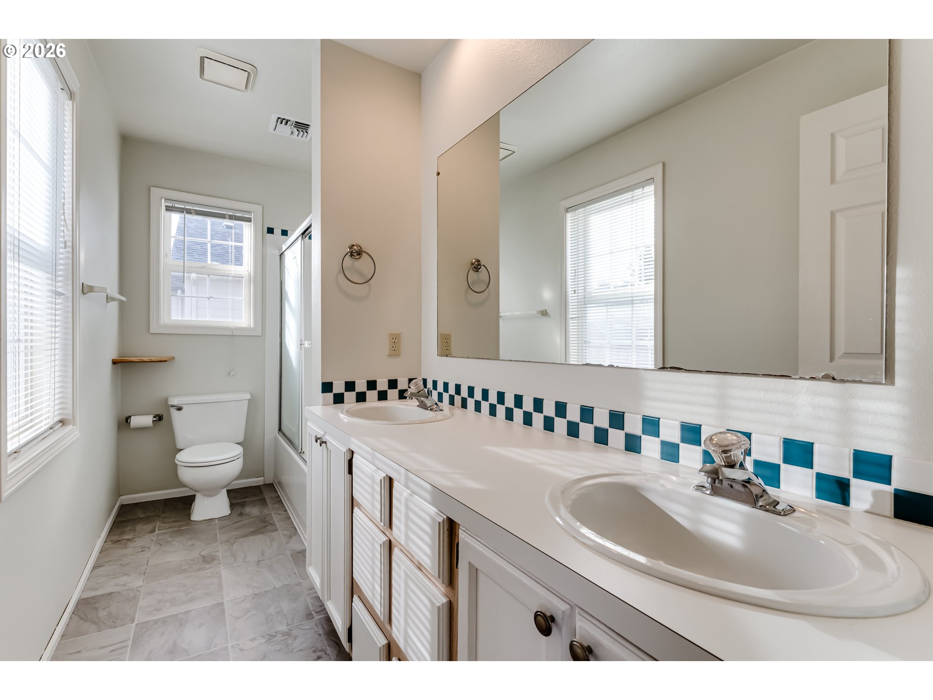 951 West 27th Avenue Eugene, OR 97405 - Photo 26 of 34 a bathroom with a sink a toilet and a mirror